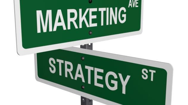 Image of street signs crossing, one says marketing one says strategy