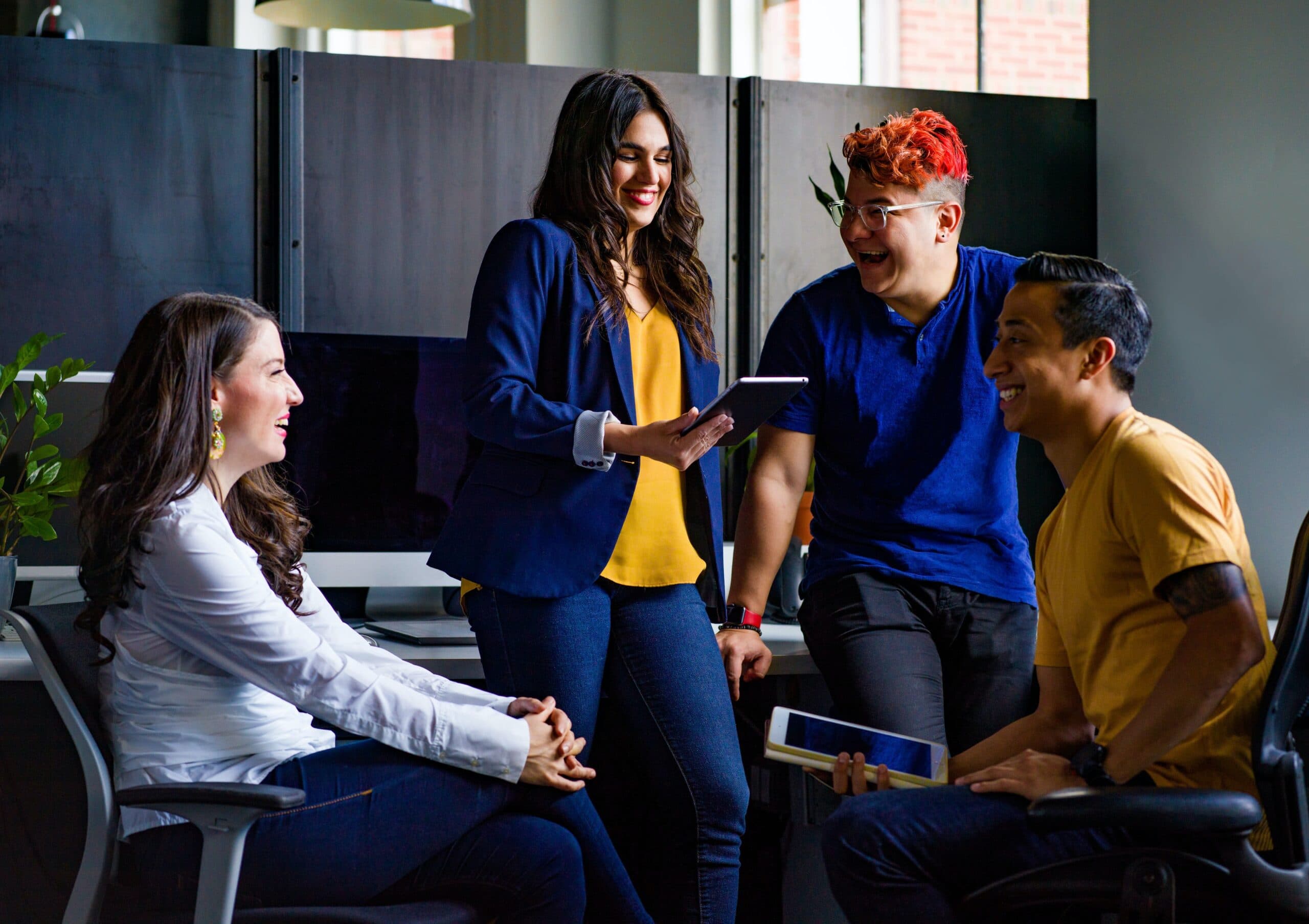 Group of young employees in a fun and happy exchange