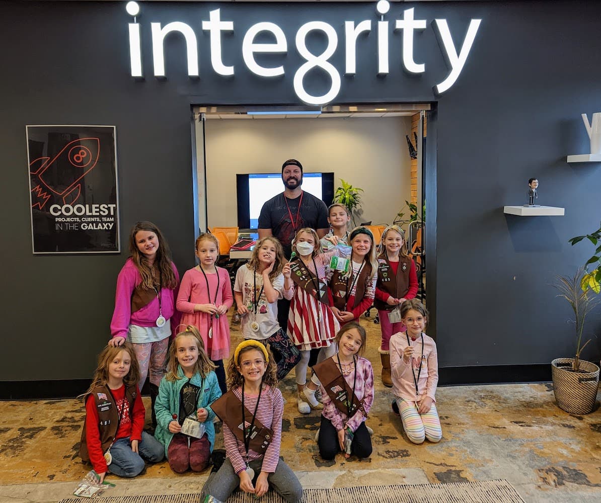 A Girl Scout troop visiting the IntegrityXD office lobby