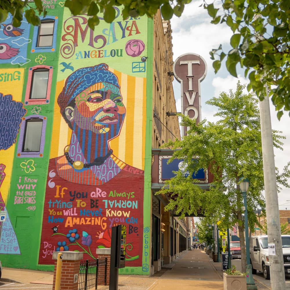 Maya Angelou mural beside the Tivoli sign in the Delmar Loop