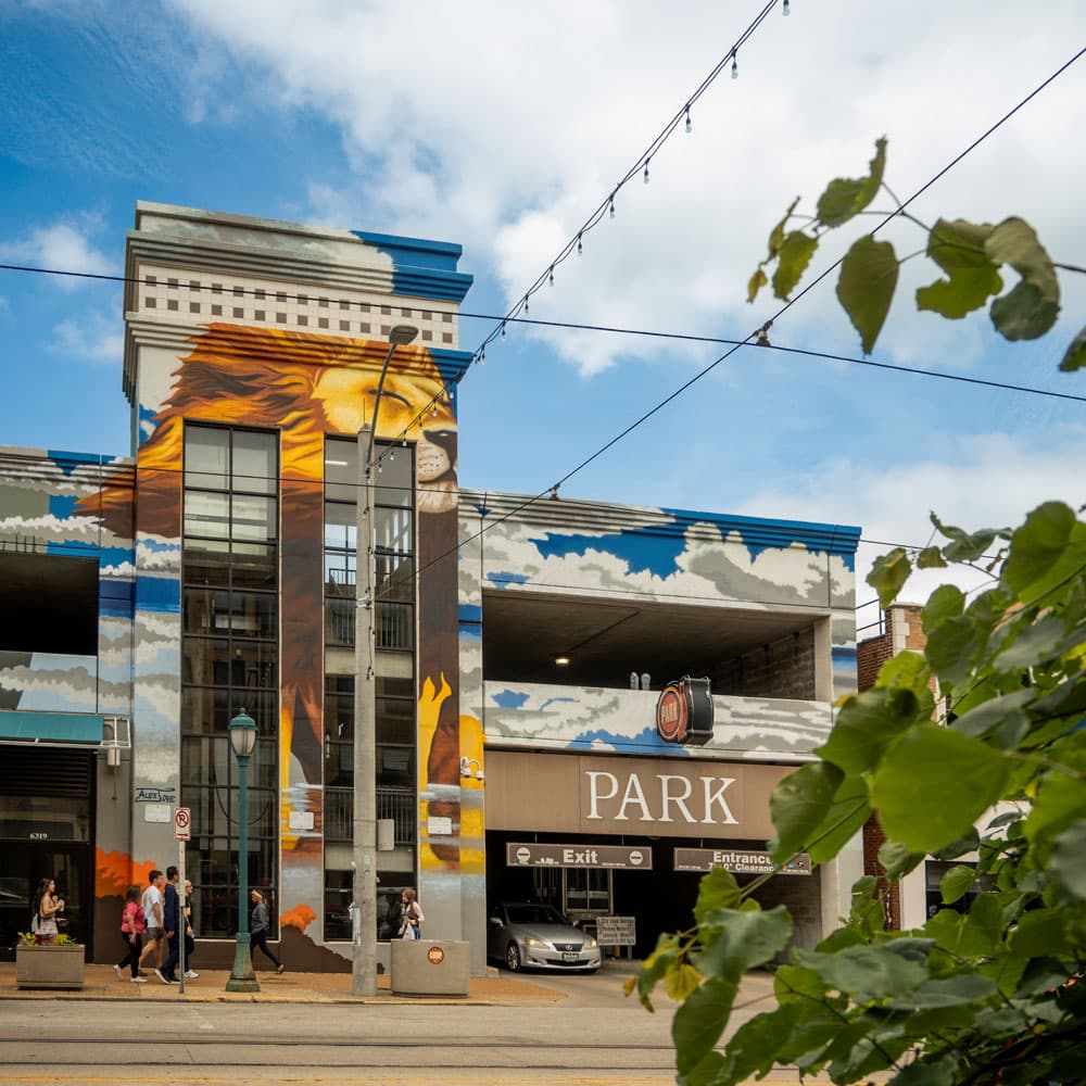 Mural-covered parking garage in the Delmar Loop