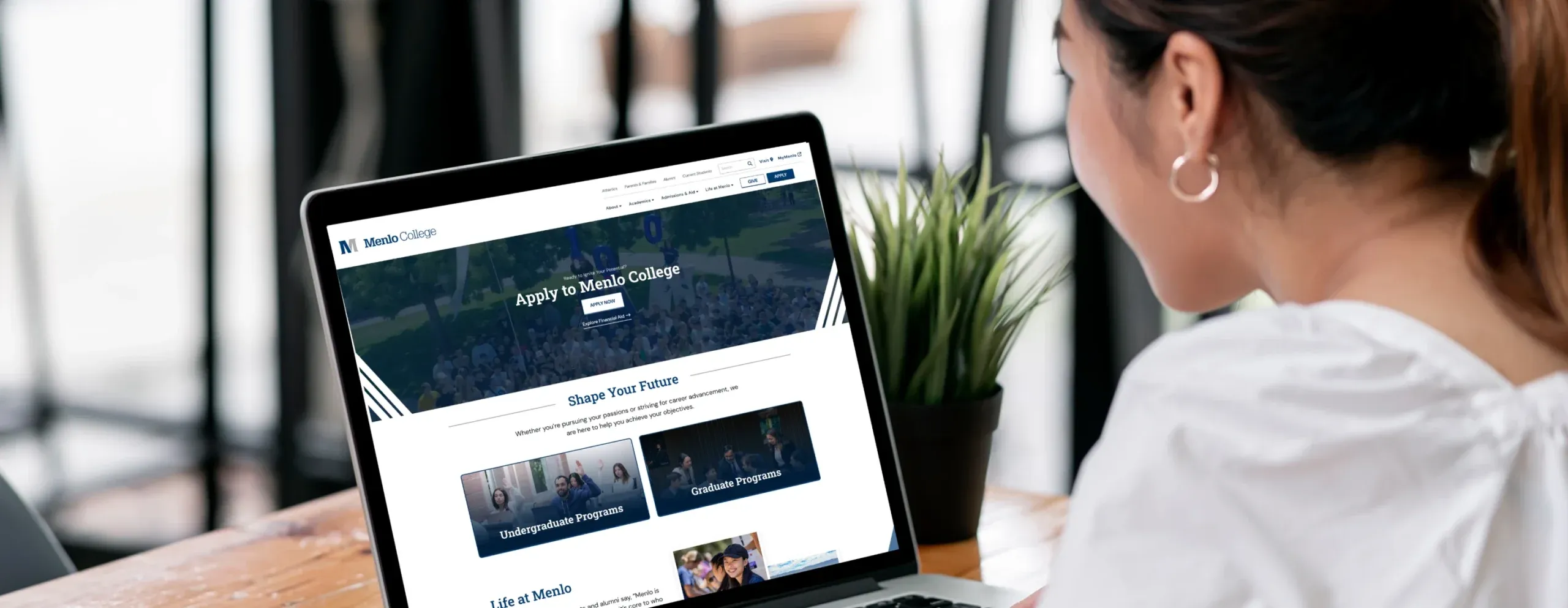 Menlo College website on a laptop
